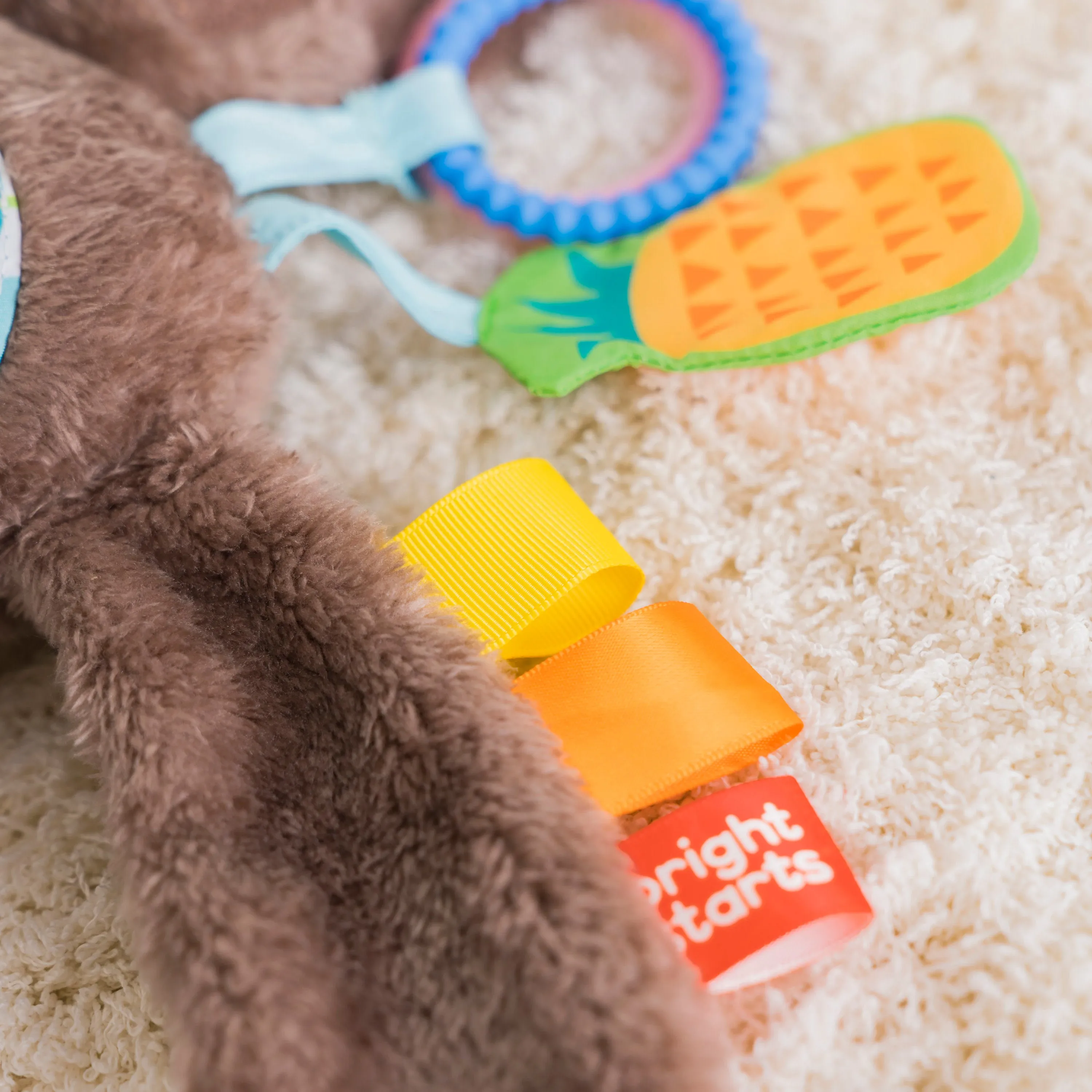 Bright Starts Slingin Sloth Travel Buddy Attachable Stuffed Animal Infant Toy